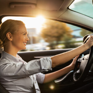 Businesswoman enjoying driving car